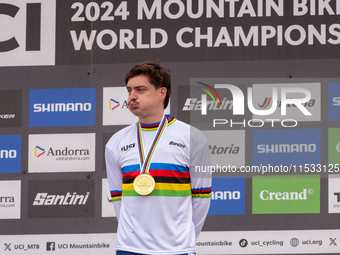 Loris Vergier of France stands on the podium at the UCI Mountain Bike World Championships Women Downhill in Pal Arinsal, Andorra, on August...