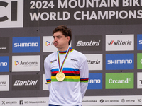 Loris Vergier of France stands on the podium at the UCI Mountain Bike World Championships Women Downhill in Pal Arinsal, Andorra, on August...