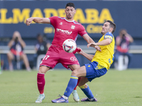 Waldo Rubio of CD Tenerife competes for the ball with Joseba Zaldua of Cadiz CF during the Liga Hypermotion match between Cadiz CF and CD Te...