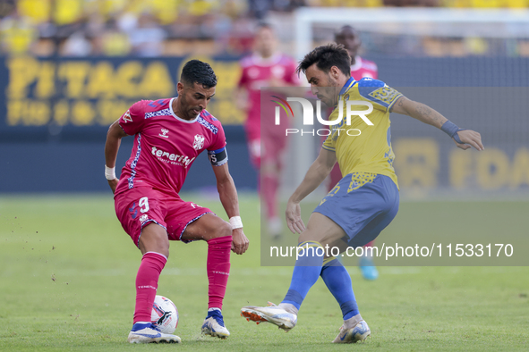 Angel Rodriguez of CD Tenerife battles for the ball during the Liga Hypermotion match between Cadiz CF and CD Tenerife at Nuevo Mirandilla i...