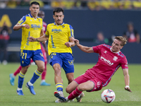 Jose Matos of Cadiz CF competes for the ball with Alejandro Cantero of CD Tenerife during the Liga Hypermotion match between Cadiz CF and CD...