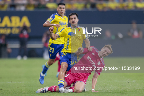 Jose Matos of Cadiz CF competes for the ball with Alejandro Cantero of CD Tenerife during the Liga Hypermotion match between Cadiz CF and CD...