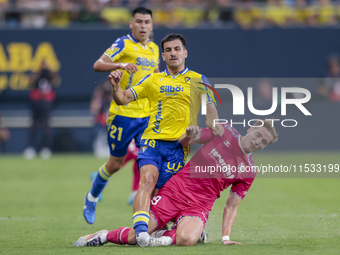 Jose Matos of Cadiz CF competes for the ball with Alejandro Cantero of CD Tenerife during the Liga Hypermotion match between Cadiz CF and CD...