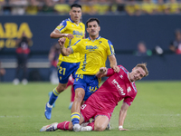 Jose Matos of Cadiz CF competes for the ball with Alejandro Cantero of CD Tenerife during the Liga Hypermotion match between Cadiz CF and CD...