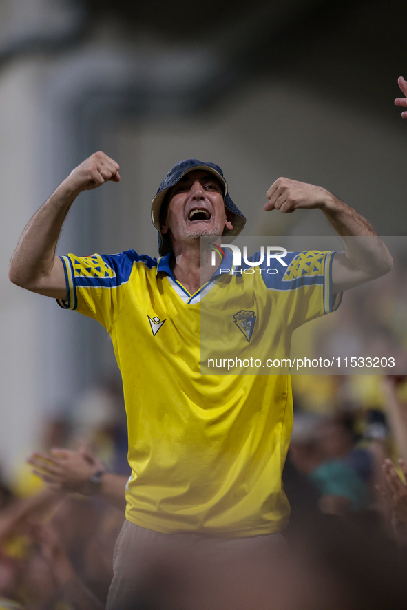 Fans of Cadiz CF celebrate a goal during the Liga Hypermotion match between Cadiz CF and CD Tenerife at Nuevo Mirandilla in Seville, Spain,...