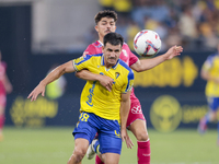 Jose Matos of Cadiz CF competes for the ball with Alassan of CD Tenerife during the Liga Hypermotion match between Cadiz CF and CD Tenerife...