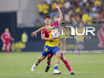 Jose Matos of Cadiz CF competes for the ball with Alassan of CD Tenerife during the Liga Hypermotion match between Cadiz CF and CD Tenerife...