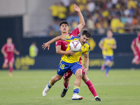 Jose Matos of Cadiz CF competes for the ball with Alassan of CD Tenerife during the Liga Hypermotion match between Cadiz CF and CD Tenerife...