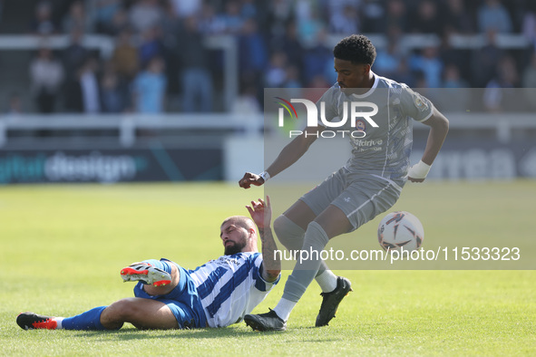 Hartlepool United's Kieron Freeman in action with Braintree Town's Kyrell Lisbie during the Vanarama National League match between Hartlepoo...