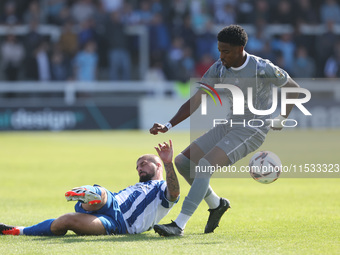 Hartlepool United's Kieron Freeman in action with Braintree Town's Kyrell Lisbie during the Vanarama National League match between Hartlepoo...