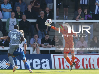 Hartlepool United's Joel Dixon saves from Braintree Town's John Akinde during the Vanarama National League match between Hartlepool United a...