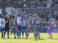 Match referee Matthew McQuillan shows Hartlepool United's Luke Waterfall a red card during the Vanarama National League match between Hartle...