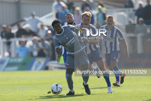 Kyrell Lisbie of Braintree Town battles for possession with Hartlepool United's Greg Sloggett during the Vanarama National League match betw...