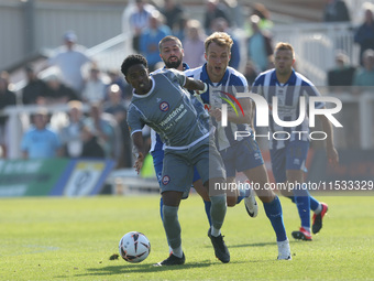 Kyrell Lisbie of Braintree Town battles for possession with Hartlepool United's Greg Sloggett during the Vanarama National League match betw...