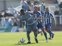 Kyrell Lisbie of Braintree Town battles for possession with Hartlepool United's Greg Sloggett during the Vanarama National League match betw...