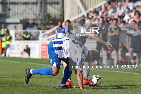 David Ferguson of Hartlepool United battles for possession with Tom Blackwell of Braintree Town during the Vanarama National League match be...