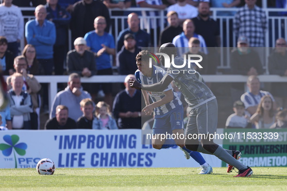 Joe Grey of Hartlepool United battles with Inih Effiong of Braintree Town during the Vanarama National League match between Hartlepool Unite...