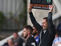 Michael Burrows, the fourth official, indicates the added time with the ''Vanarama National League'' board during the Vanarama National Leag...