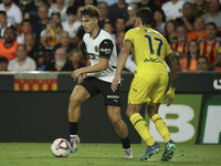 Sergi Canos of Valencia CF (L) and Villarreal's Kiko Femenia during the La Liga match between Valencia CF and Villarreal CF at Mestalla Stad...