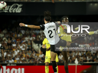 Jesus Vazquez of Valencia CF (left) and Villarreal's Thierno Mamadou Barry during the La Liga match between Valencia CF and Villarreal CF at...