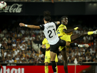 Jesus Vazquez of Valencia CF (left) and Villarreal's Thierno Mamadou Barry during the La Liga match between Valencia CF and Villarreal CF at...