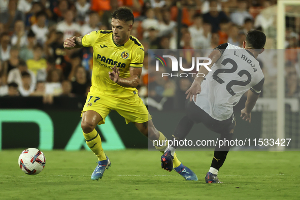 Villarreal's Kiko Femenia (L) and Luis Rioja of Valencia CF during the La Liga match between Valencia CF and Villarreal CF at Mestalla Stadi...