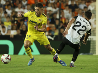 Villarreal's Kiko Femenia (L) and Luis Rioja of Valencia CF during the La Liga match between Valencia CF and Villarreal CF at Mestalla Stadi...