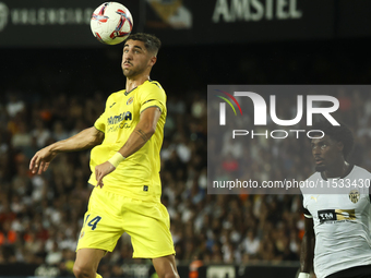 Villarreal's Santi Comesana (left) and Thierry Correia of Valencia CF during the La Liga match between Valencia CF and Villarreal CF at Mest...