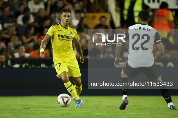 Villarreal's Kiko Femenia (L) and Luis Rioja of Valencia CF during the La Liga match between Valencia CF and Villarreal CF at Mestalla Stadi...