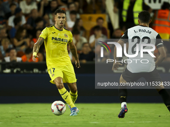 Villarreal's Kiko Femenia (L) and Luis Rioja of Valencia CF during the La Liga match between Valencia CF and Villarreal CF at Mestalla Stadi...