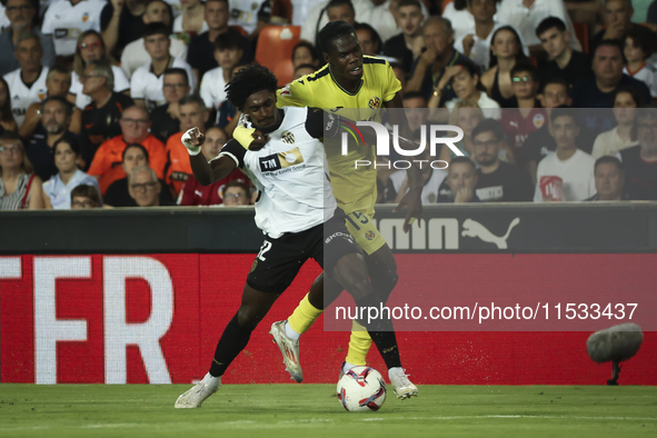 Thierry Correia of Valencia CF (left) and Villarreal's Thierno Mamadou Barry during the La Liga match between Valencia CF and Villarreal CF...