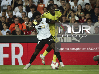 Thierry Correia of Valencia CF (left) and Villarreal's Thierno Mamadou Barry during the La Liga match between Valencia CF and Villarreal CF...