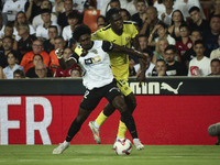 Thierry Correia of Valencia CF (left) and Villarreal's Thierno Mamadou Barry during the La Liga match between Valencia CF and Villarreal CF...