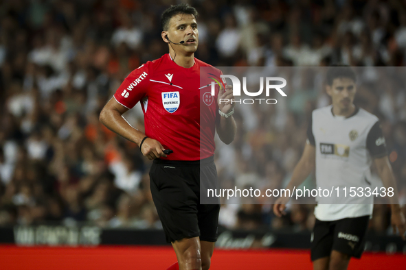 Jesus Gil Manzano referees during the La Liga match between Valencia CF and Villarreal CF at Mestalla Stadium in Valencia, Spain, on August...