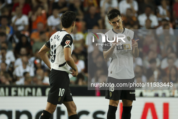 Andre Almeida of Valencia CF (left) and Pepelu, Jose Luis Garcia Vaya, of Valencia CF during the La Liga match between Valencia CF and Villa...