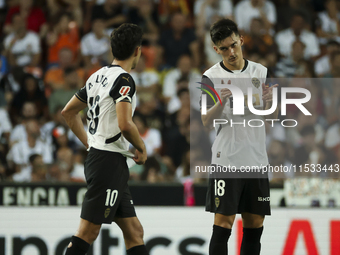 Andre Almeida of Valencia CF (left) and Pepelu, Jose Luis Garcia Vaya, of Valencia CF during the La Liga match between Valencia CF and Villa...