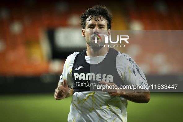 Juan Bernat of Villarreal CF and Ruben Baraja after the La Liga match between Valencia CF and Villarreal CF at Mestalla Stadium in Valencia,...