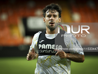 Juan Bernat of Villarreal CF and Ruben Baraja after the La Liga match between Valencia CF and Villarreal CF at Mestalla Stadium in Valencia,...