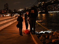 Bone fragments are recovered along the shoreline in Brooklyn Bridge Park in Brooklyn, New York, United States, on August 31, 2024. At approx...