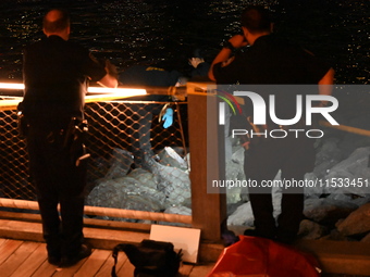 Bone fragments are recovered along the shoreline in Brooklyn Bridge Park in Brooklyn, New York, United States, on August 31, 2024. At approx...