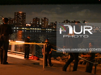 Bone fragments are recovered along the shoreline in Brooklyn Bridge Park in Brooklyn, New York, United States, on August 31, 2024. At approx...