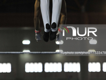 Men's floor artistic gymnast, Farhan Nasani from West Sumatra, competes in front of the jury in the final round at PON XXI at the Sport Cent...