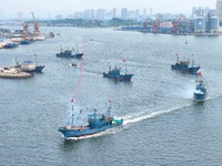 Fishing boats go out to sea from the central fishing port of Yangma Island in Yantai, China, on September 1, 2024. (