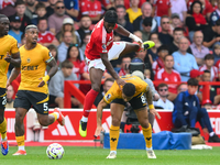 Joao Gomes of Wolverhampton Wanderers fouls Anthony Elanga of Nottingham Forest during the Premier League match between Nottingham Forest an...