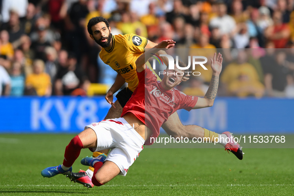 Neco Williams of Nottingham reacts after Rayan Ait-Nouri of Wolverhampton Wanderers commits a foul during the Premier League match between N...