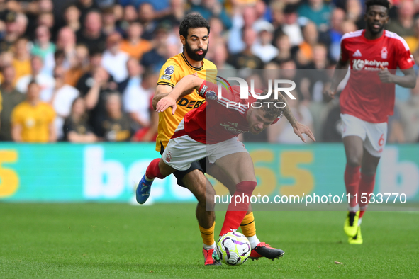 Rayan Ait-Nouri of Wolverhampton Wanderers battles with Neco Williams of Nottingham Forest during the Premier League match between Nottingha...