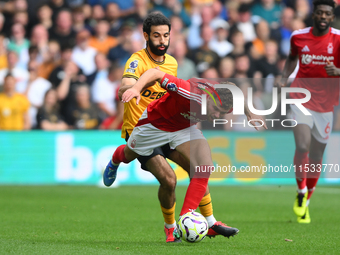 Rayan Ait-Nouri of Wolverhampton Wanderers battles with Neco Williams of Nottingham Forest during the Premier League match between Nottingha...