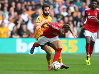 Rayan Ait-Nouri of Wolverhampton Wanderers battles with Neco Williams of Nottingham Forest during the Premier League match between Nottingha...