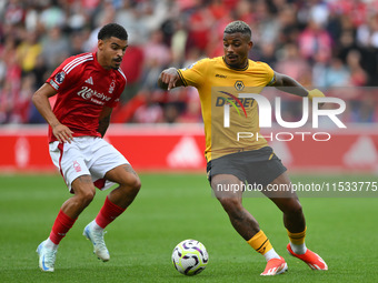 Mario Lemina of Wolverhampton Wanderers is under pressure from Morgan Gibbs-White of Nottingham Forest during the Premier League match betwe...