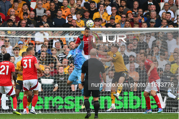 Murillo of Nottingham Forest heads the ball clear under pressure from Jorgen Strand Larsen of Wolverhampton Wanderers during the Premier Lea...